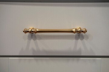 Close up detail of classic brass drawer handle