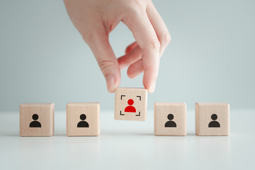 Hand choose red human icon with focus frame. Individuality, unique, difference, Business hiring and recruitment selection. Human Resource Management. Leadership. Choice of new employees to team.