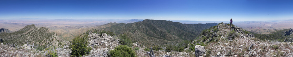 Fototapeta na wymiar Panorama From Virgin Peak In Nevada With Woman On Ridge