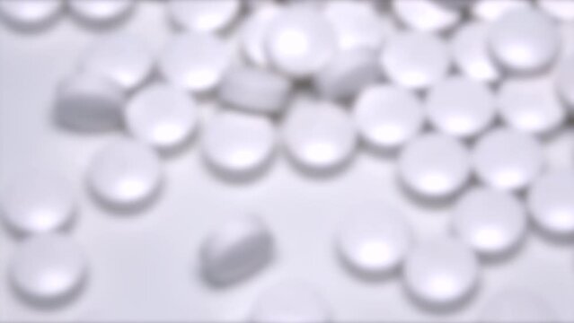 ぼかし背景素材: 大量の白色錠剤の薬、サプリメントのズームインショット  クローズアップ  4K