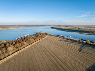 confluence of  the Mississippi  and Ohio Rivers below Cairo, IL with Fort Defiance State Park anad farmland, November aerial view - obrazy, fototapety, plakaty