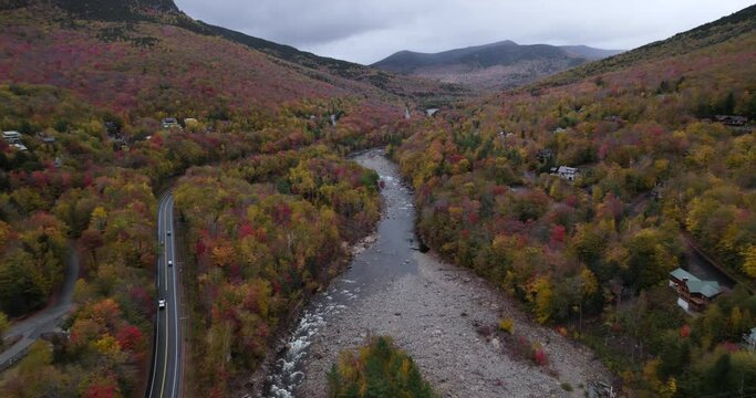 Drone View of Kancamagus Highway Along River in the Trees