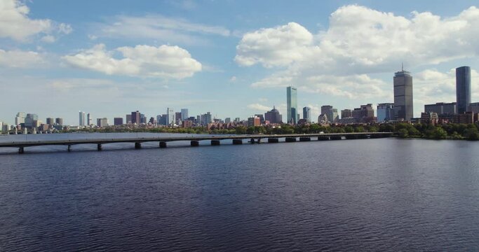 Drone Circling Over Charles River in Boston Massachusetts with View of Harvard Bridge