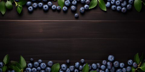 Ripe blueberries framed by fresh green leaves on a dark wooden surface. Copy space, frame. Background or banner design - Powered by Adobe