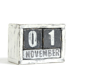 November 01 on wooden calendar, on white background.