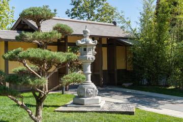 Traditional Japanese lamp Japanese Kasuga-toro lantern made of stone. Close-up. Element of...