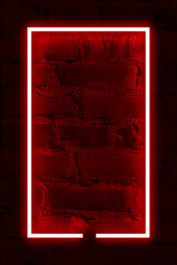 Dark brick wall background, red neon light and rectangle shape with vertical banner.