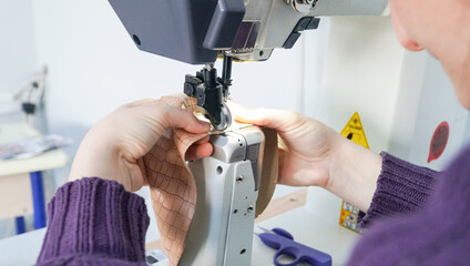 The shoemaker works meticulously