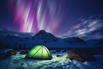 Camping Under Spectacular Aurora Borealis in Snowy Mountain Wilderness in Green Tent