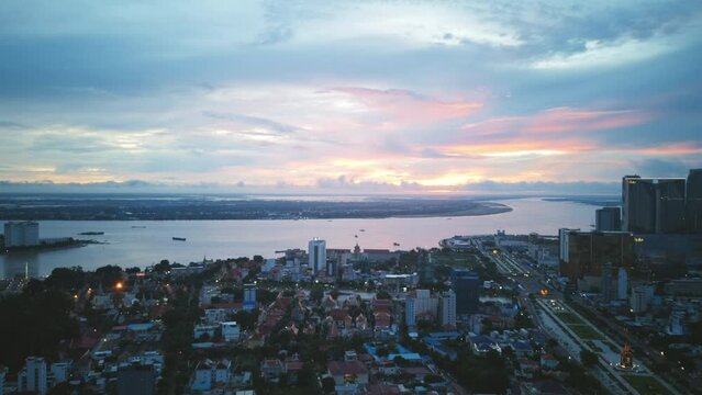 Aerial timelapse panning across downtown and the Mekong River in Phenom Penh, Cambodia.