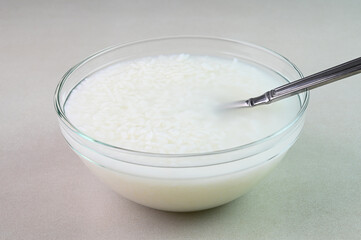 Rice water in a bowl. Cooked soaked rice water served in a bowl.