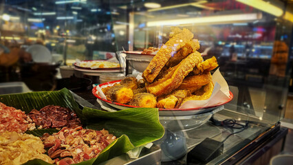Showcase of a Thai street restaurant with traditional Thai a la carte menu, Street food, Raw meat...