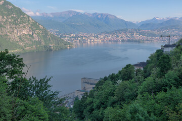 View of Lugano city and Lake Lugano from above, Switzerland. Below the Italian town of Campione d'Italia with the casino