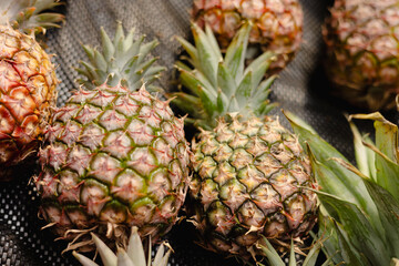 fresh pineapple on the table, fruit market display item
