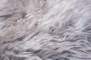 close up of a white fur texture, fabric for making winter clothes, fluffy and warm