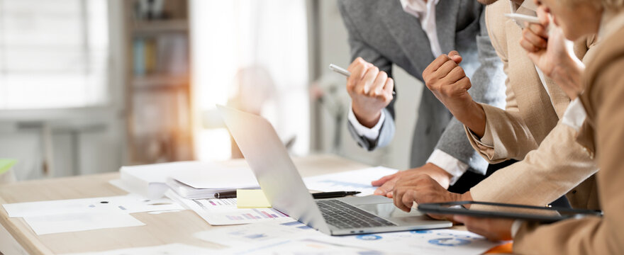 Business professionals team celebrating together at office. Successful business concept.