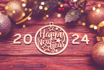 Happy new year 2024 on wooden brown background
