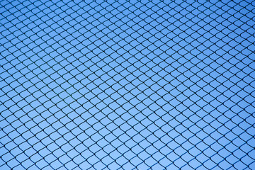 Chain Link Fence against a Clear Blue Sky