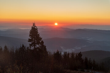 Sunrise from Lysa hora hill in autumn Moravskoslezske Beskydy mountains in Czech republic