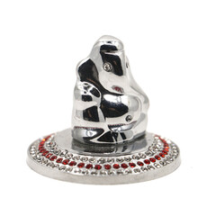 shiny silver idol decorated with beads, of ganesh, an elephant god from hindu mythology isolated in a white background, mini statue used to stick on dashboard of vehicles