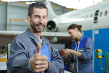 portrait of pilot giving thumbs-up