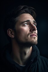Fototapeta premium The handsome individual gazing into the distance, lost in thought. The HD camera captures the raw emotion on their face, highlighting their intelligence and depth.