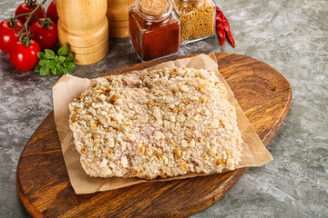 Breaded raw breaded meat schnitzel