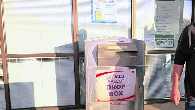 Multiple Men Vote by Casting Mail-in Ballot Letters in Slot at Voting Booth with Offical Ballot Drop Box Sign for Democratic Government Election in Presidential Race