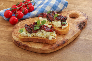 Bruschetta with soft cheese and tomato