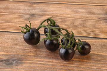 Ripe tasty black cherry tomato