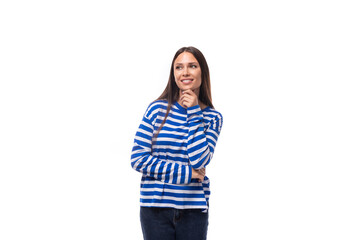 young slender european brunette woman dressed in a striped blue sweater on a white background