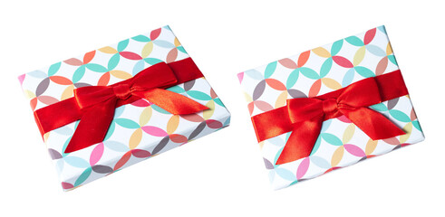 Gift wrapped in pastel color paper with red bow tie, isolated on white or transparent background cutout.