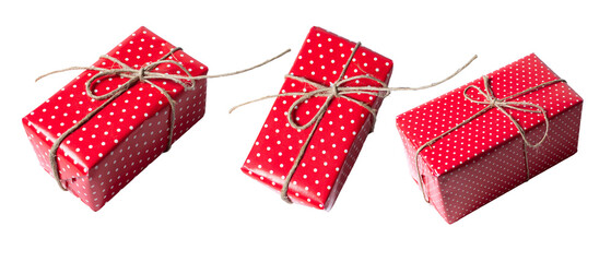 Gift wrapped in red paper tied with sisal twine, isolated on white or transparent background cutout.