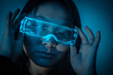 Beautiful young chinese woman wearing futuristic glasses