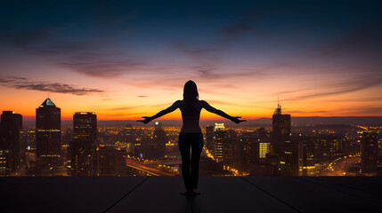 silhouette of a person in a urban city in an evening with beautiful sky with colors , yoga fitness meditation concept