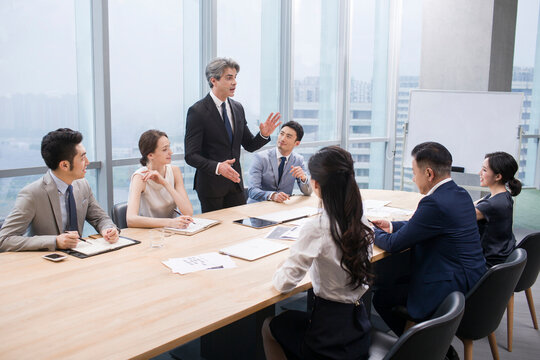 Business people having meeting in board room