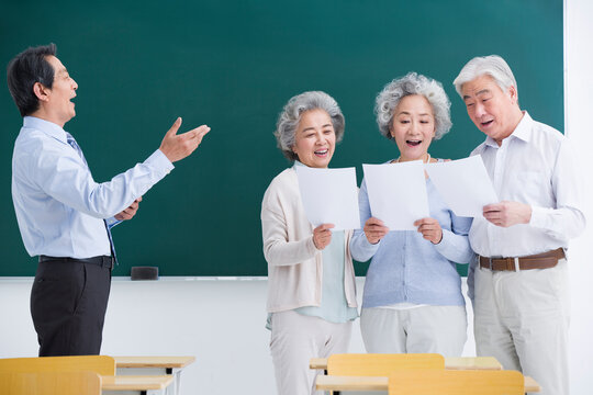 Senior adults having music class at school