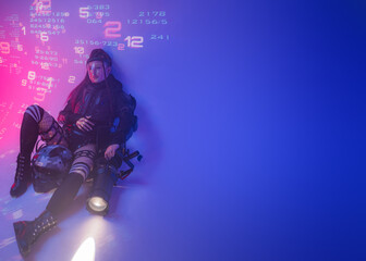 A female figure, dressed in a futuristic tactical black ensemble, reclines on the ground with a...