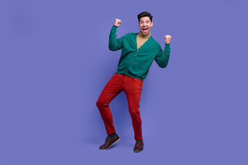 Full length photo of overjoyed cheerful man dressed trendy clothes rejoice good news yell yeah hooray isolated on purple color background