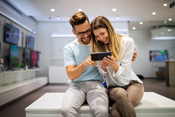 Happy couple enjoying social media content in a smart phone. Communication, connection concept.