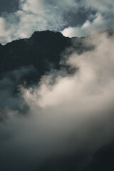 Spectacular and amazing beautiful panorama of the Andes Mountains in the Colca Canyon, Peru. Natural compostion with beautiful luminous white clouds. Mystery atmosphere.