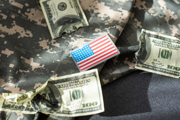 USA flag and money. Cash for VA loan from U.S. Department of Veterans Affairs.