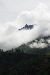 Spectacular and amazing beautiful panorama of the Andes Mountains in the Colca Canyon, Peru. White clouds, wonderful cloudscape. Cliff, blue sky.