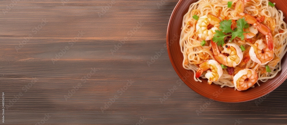 Poster Top down view of appetizing shrimp and rice noodles on a plate copy space image