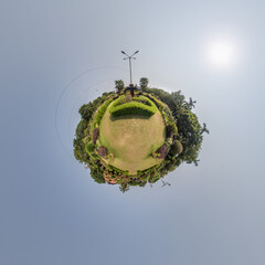 coconut trees in jungle in Indian tropic village on sea shore on little planet in evening sky, transformation of spherical 360 panorama. Spherical abstract view with curvature of space.