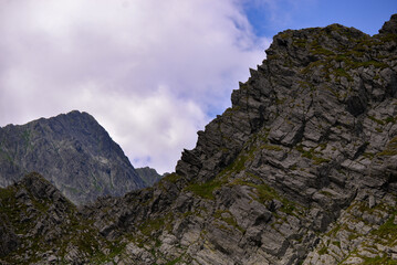 High and rocky mountains in the summer season. Landscape with the wild Carpathians of Romania