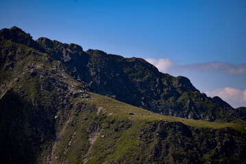 High and rocky mountains in the summer season. Landscape with the wild Carpathians of Romania