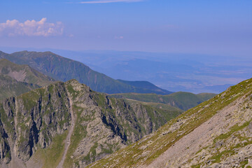 High and rocky mountains in the summer season. Landscape with the wild Carpathians of Romania