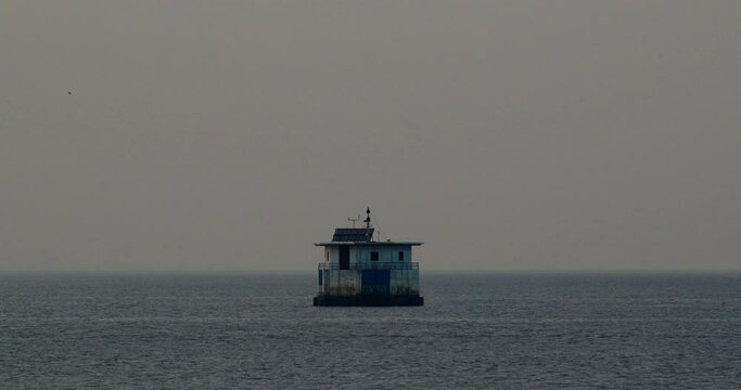 Lonely house in the water, lighthouse in the water, water station, in the sea or ocean, sunset, no people
