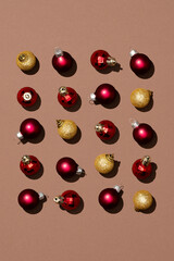 Shiny red and gold Christmas balls on brown background